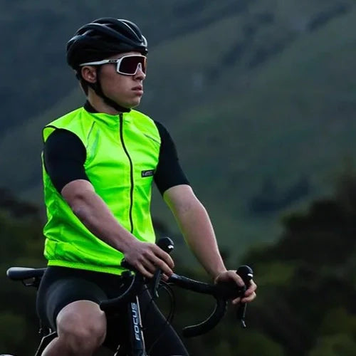 Cyclist wearing a vest while riding outside